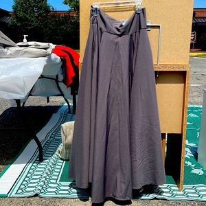 Gray maxi skirt with pockets. Decorative tie in back.